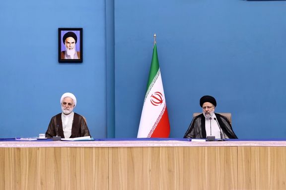 Iran's Chief Justice Gholamhossein Mohseni Ejei (left) and President Ebrahim Raisi during a meeting in Tehran on October 10, 2023
