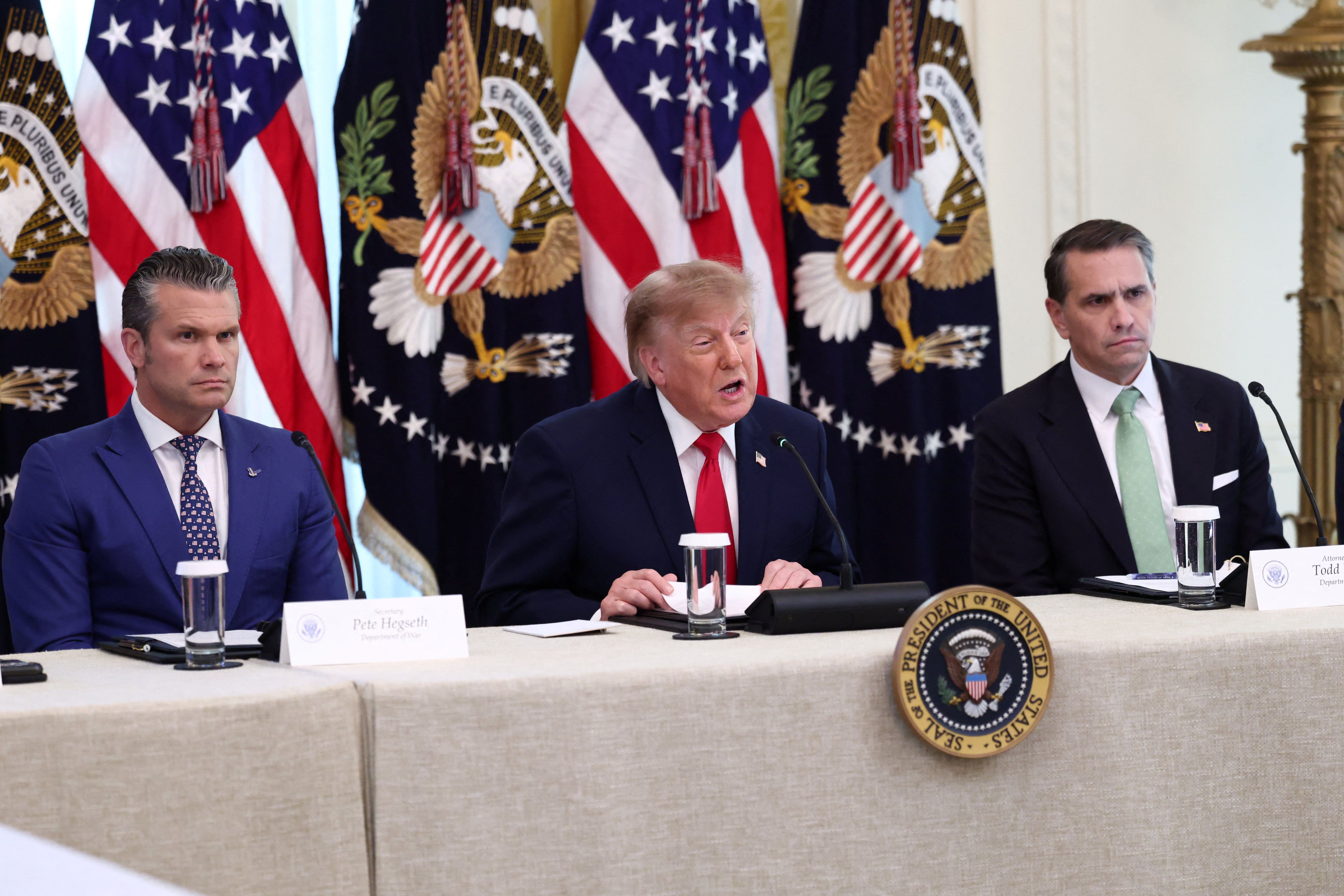 US President Donald Trump speaks during a round table with Defense Secretary Pete Hegseth and Attorney General Todd Blanche at the White House in Washington, DC, October 21, 2026.