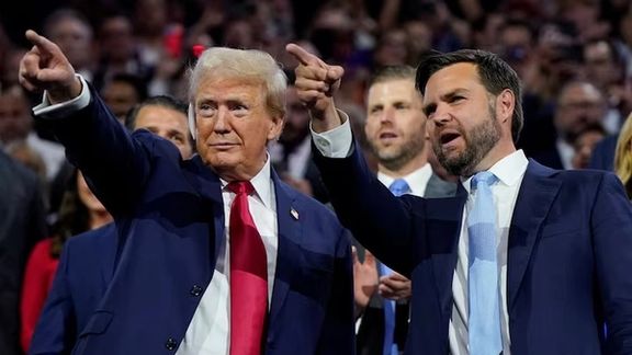 Republican presidential nominee and former U.S. President Donald Trump and Republican vice presidential nominee J.D. Vance point to the stage during Day 1 of the Republican National Convention (RNC), at the Fiserv Forum in Milwaukee, Wisconsin, US, July 15, 2024.