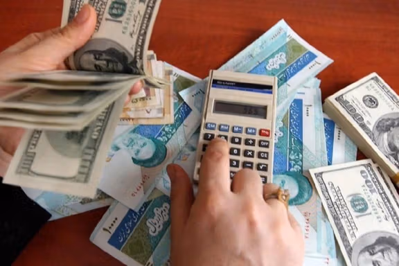 Photo showing Iranian currency and dollars