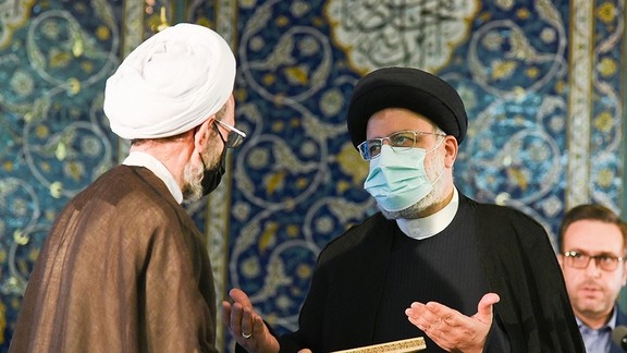 President Ebrahim Raisi handing out Quran awards last week, while critics demand management of the economy.