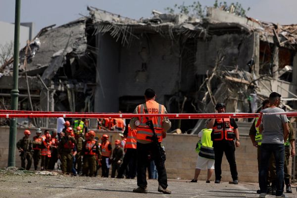 Iran holds off hitting US as Trump hints at regime change