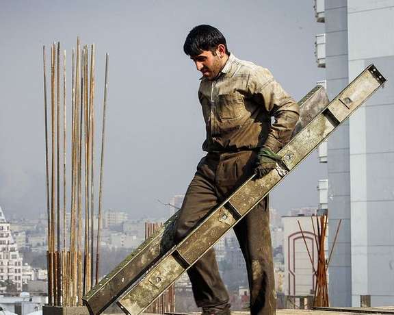 An Iranian worker in the capital Tehran