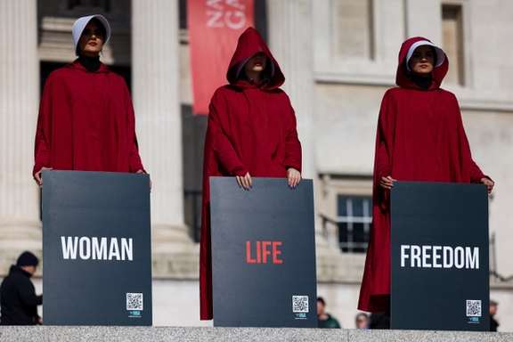 Demonstrators, wearing The Handmaid's Tale costumes, take part in a rally against the oppression of women in Iran, on International Women's Day, in Piccadilly Circus, in London, Britain March 8, 2024.