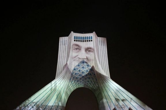 Photos of former IRGC-Quds Force commander Qasem Soleimani projected over Tehran’s Azadi tower