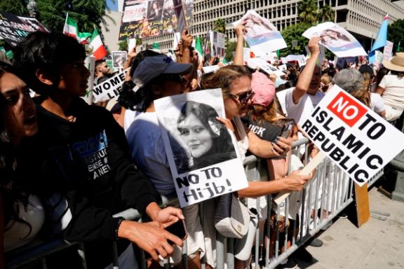 Demonstrators display images of Mahsa (Zhina) Amini, a 22-year-old Iranian Kurdish woman who died in police custody, during a rally outside City Hall in Los Angeles, California, US, October 1, 2022.