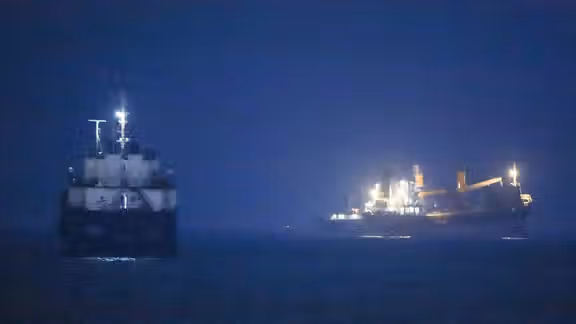 Ships are seen near the Strait of Hormuz in a handout image released by Iranian state media on June 21, 2026.