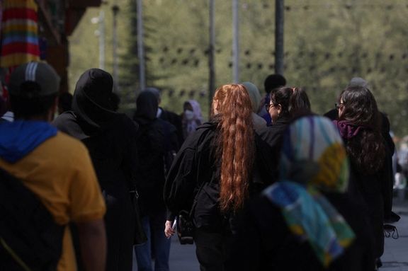 Iranian women walk on a street amid the implementation of the new hijab surveillance in Tehran, Iran, April 15, 2023.
