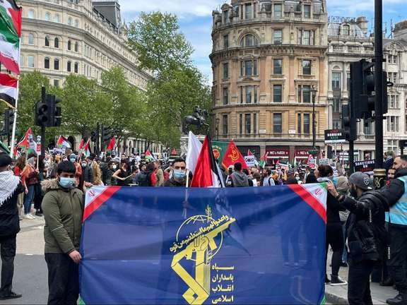 Supporters of Iran's Islamic Revolutionary Guard Corps (IRGC) with a banner in central London, UK, June 2022