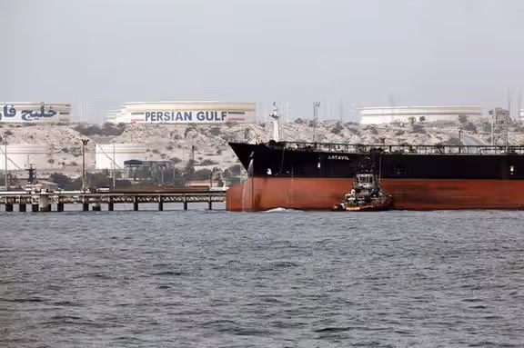 An Iranian oil tanker starting its journey near a loading dock in August.