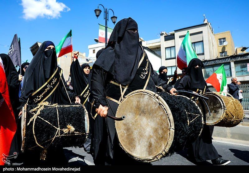 Pro-government women dressed in black beat drums during a procession marking the 40th day since the death of Iran’s Supreme Leader Ali Khamenei in Tehran on April 9, 2026.