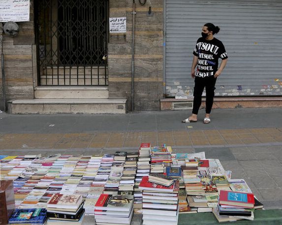 A street bookseller in Tehran, Iran. Undated