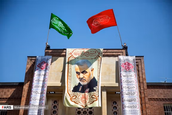 The main US embassy building covered with Qasem Soleimani's banner. 2020