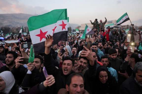 Syrians celebrate the fall of Bashar al-Assad on December 12, 2024.