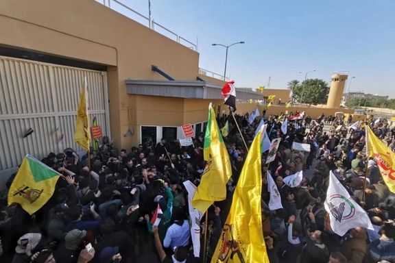 Pro-Iran Iraqi militants attacking the US embassy in Baghdad in December 2019
