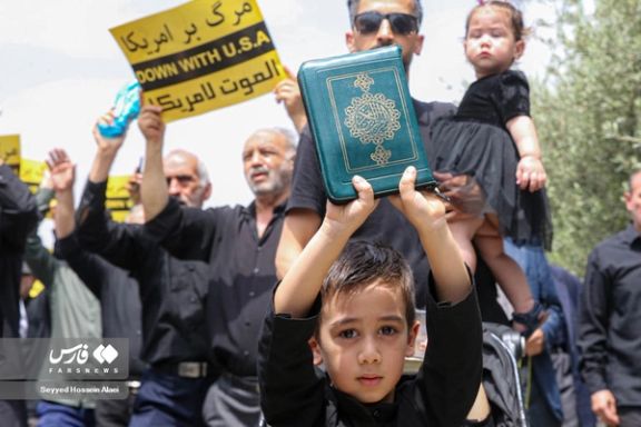 A regime-sponsored rally against the burning of the Quran