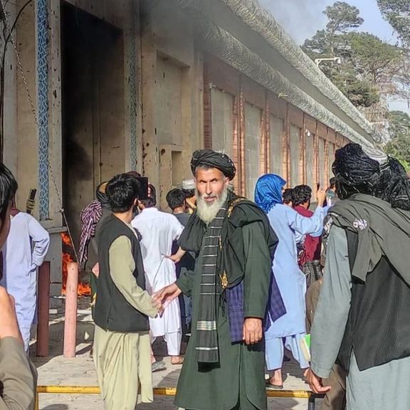 Afghan protesters set fire to the entrance of Iran's consulate in Herat. April 11, 2022