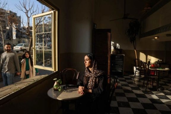 An Iranian woman sits in a cafe in Tehran, Iran, in this December 2024 file photo.