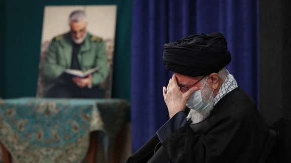 Iran's ruler Ali khamenei in January 2021, with picture of IRGC's Qasem Soleimani seen in the background