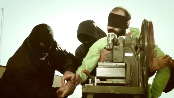 File photo of a prisoner being amputated by a guillotine-like device in Iran