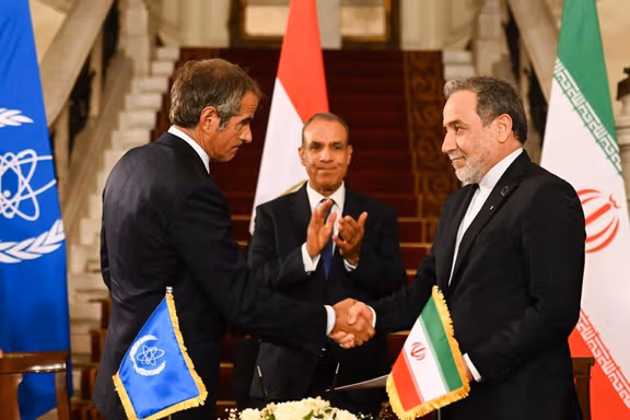 IAEA director general Rafael Grossi shakes hand with Iran's foreign minister Abbas Araghchi following a meeting in Cairo, Egypt, September 9, 2025