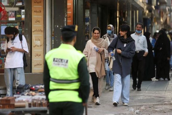 Iranian women walk on a street during the revival of morality police in Tehran, July 16, 2023.