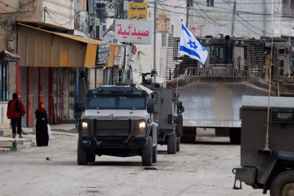 Israeli military vehicles operate during an Israeli raid in Jenin, in the Israeli-occupied West Bank, January 22, 2025.