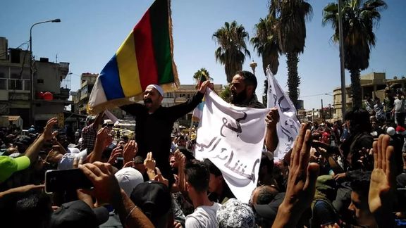 People protest against the latest decisions by Syrian government on increasing the prices of fuels in Sweida, Syria August 24, 2023 in this picture obtained from social media.