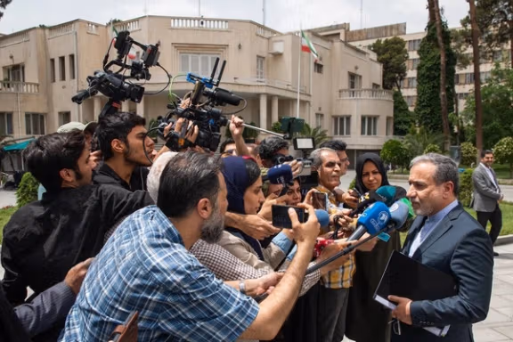 Iran's Foreign Minister Abbas Araghchi speaking to reporters in Tehran on May 14, 2025