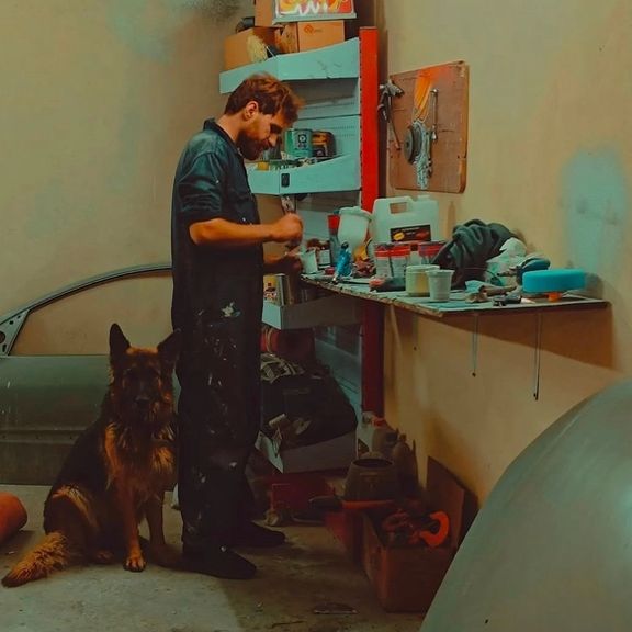 Ali Karami and Ariel pictured in Karami's auto repair shop in Tehran.
