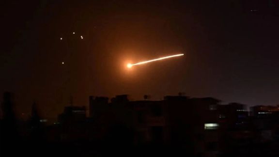 Missiles streak through the sky in an earlier Israeli attack on Iranian targets in Syria.