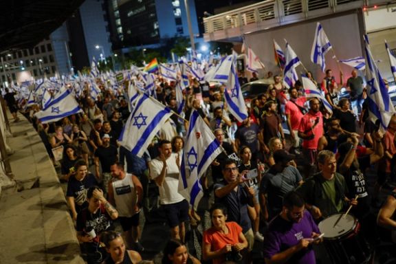 Protesters attend a demonstration against Israeli Prime Minister Benjamin Netanyahu and his nationalist coalition government's judicial overhaul, days after a parliament vote on a contested bill that limits the Supreme Court's powers to void some government decisions, in Tel Aviv, Israel July 27, 2023.