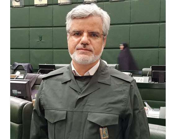 Photo of Mahmoud Sadeghi wearing the IRGC's outfit during a parliamentary session where all MPs expressed their support for the Revolutionary Guard in April 2019