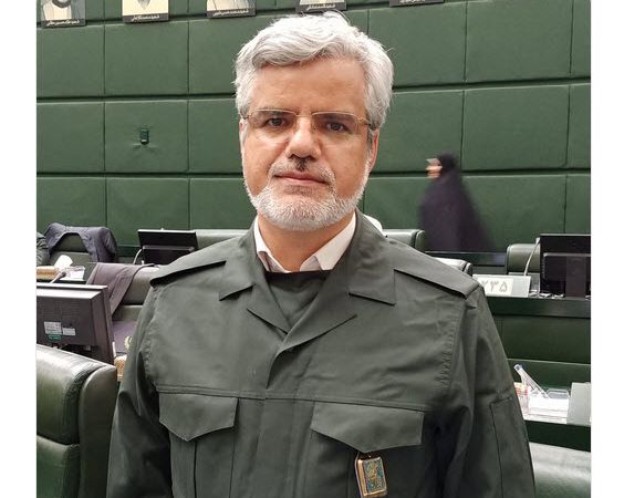 Photo of Mahmoud Sadeghi wearing the IRGC's outfit during a parliamentary session where all MPs expressed their support for the Revolutionary Guard in April 2019