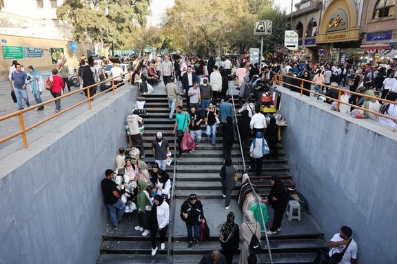 Iranian people walk at the Tehran Bazaar after the approval of the bill to remove four zeros from the national currency, in Tehran, Iran, October 5, 2025.