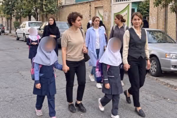 Bareheaded mother, veiled daughter: Iran's schools keep a rule its streets have dropped