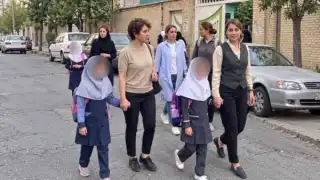 Bareheaded mother, veiled daughter: Iran's schools keep a rule its streets have dropped