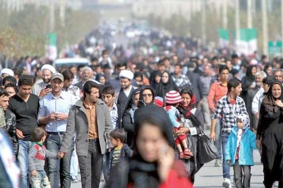 A crowd of people seen walking in Tehran in 2020
