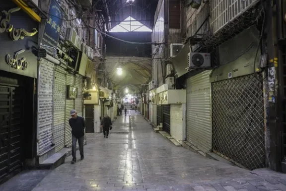 People walk past closed shops in Tehran's Grand Bazaar, January 15, 2026.