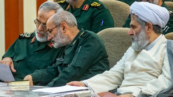 The head of the Revolutionary Guard's intelligence organization, Mohammad Kazemi (center) and his predecessor Hossein Taeb (right)
