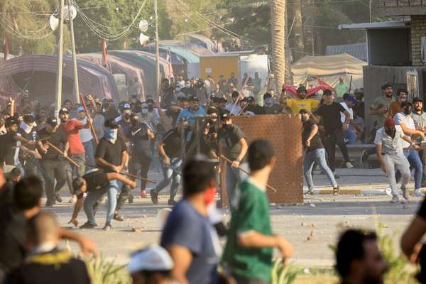 Iraqi Army Declares Curfew After Sadrists Attack Government Buildings