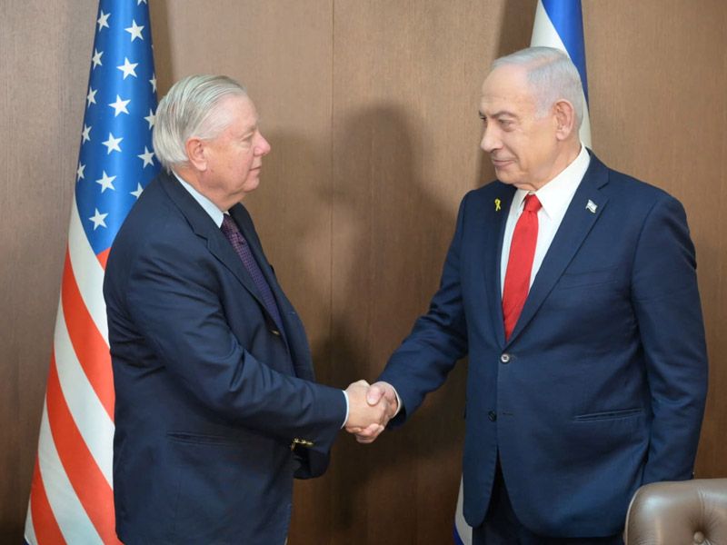 Israeli Prime Minister Benjamin Netanyahu greets US Senator Lindsey Graham at his office in Jerusalem, December 21, 2025.