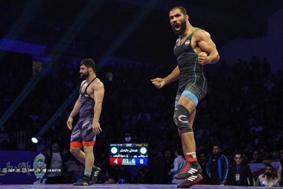 Iranian wrestler Hadi Vafaeipour (right)