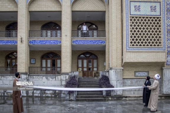 Two clerics preparing a turban for a ceremony where new mullahs are officially given the right to put on a turban, Gorgan, Golestan province, northern Iran (February 2024)