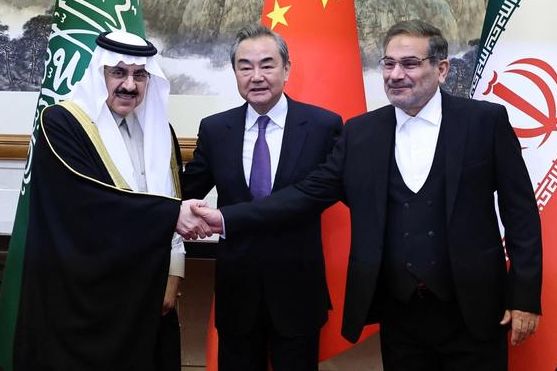 Wang Yi, China’s chief diplomat, Ali Shamkhani (R), Iran’s national security chief, and Saudi representative Musaad bin Mohammed Al Aiban in Beijing, March 10, 2023