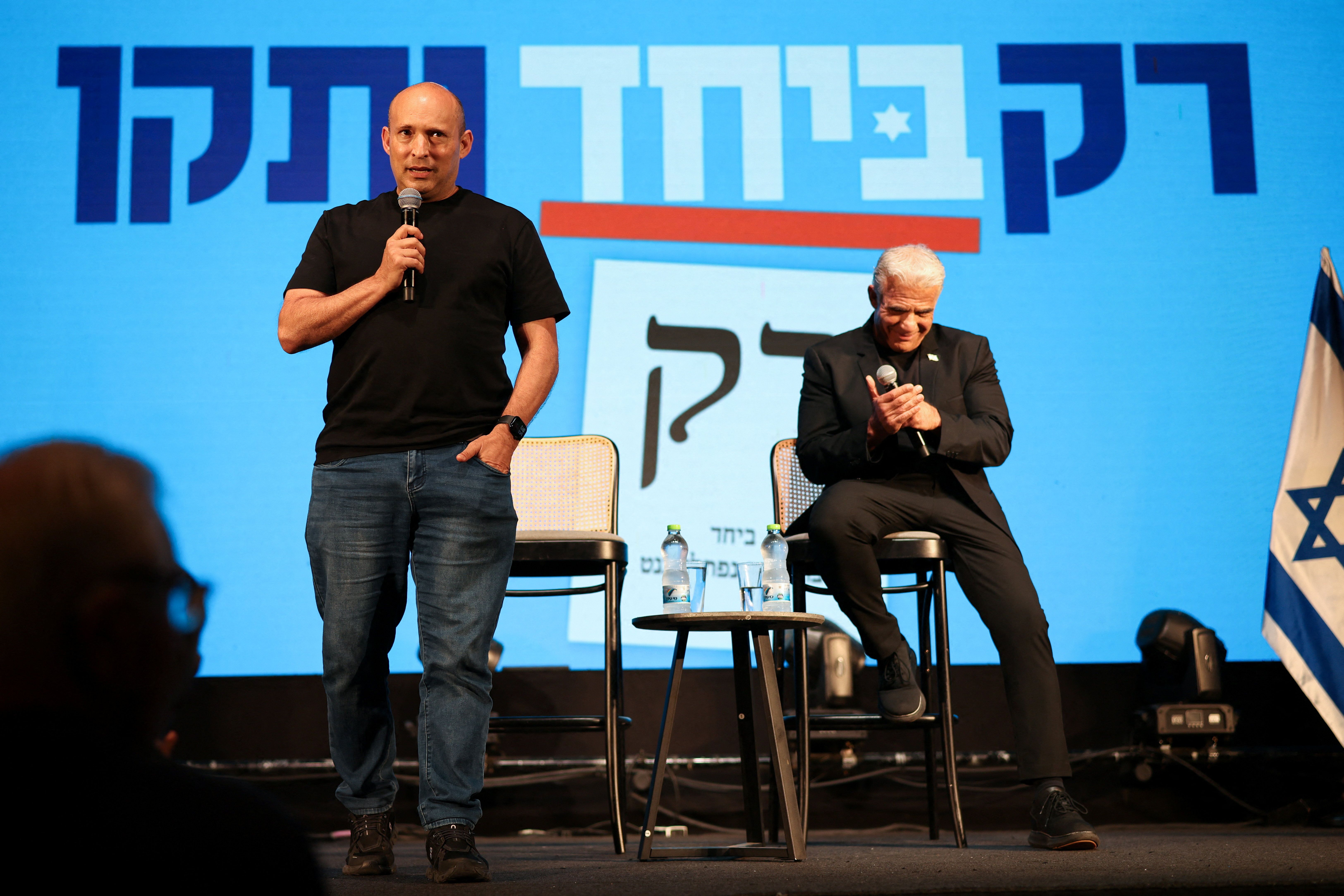 Former prime ministers Naftali Bennett and Yair Lapid attend an event for their B'Yachad party, ahead of Israel’s national election, in Haifa, Israel, October 21, 2026.