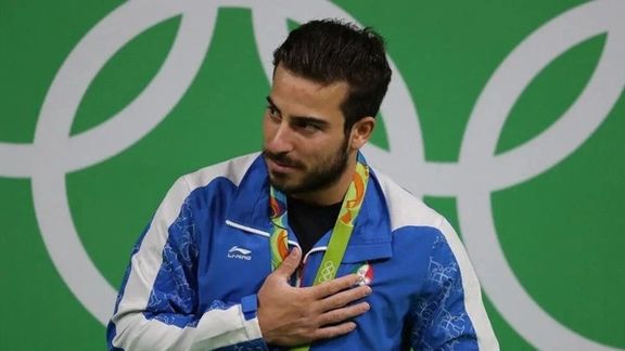 بطل أولمبي إيراني سابق: سأذهب إلى بطولة العالم بصفة "محايد"