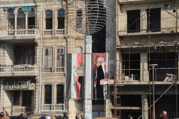 تصویر پاره شده بشار اسد، رییس حکومت سوریه، حلب، ۱۰ آذر