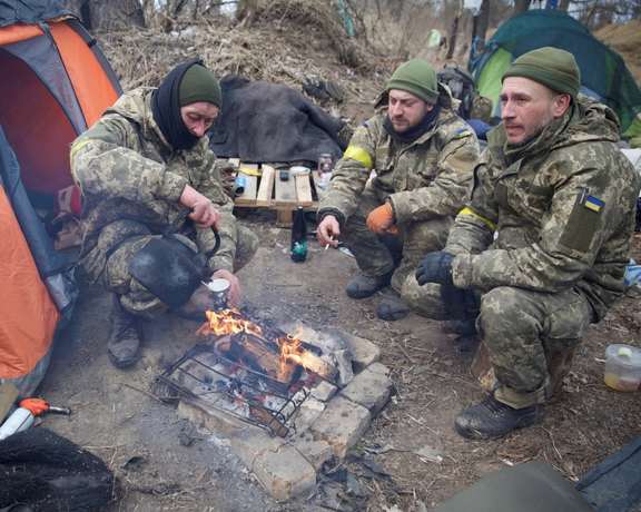 Ukrainian defenders in this photo taken near Kyiv on March 8. 2022