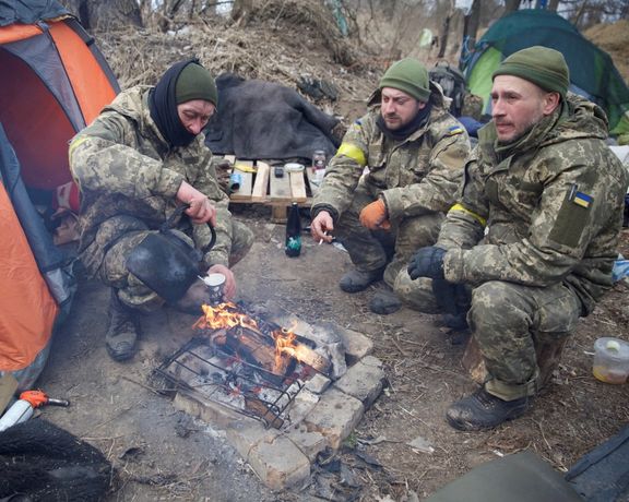 Ukrainian defenders in this photo taken near Kyiv on March 8. 2022